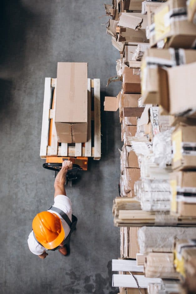 Warehouse operative picking boxed stock